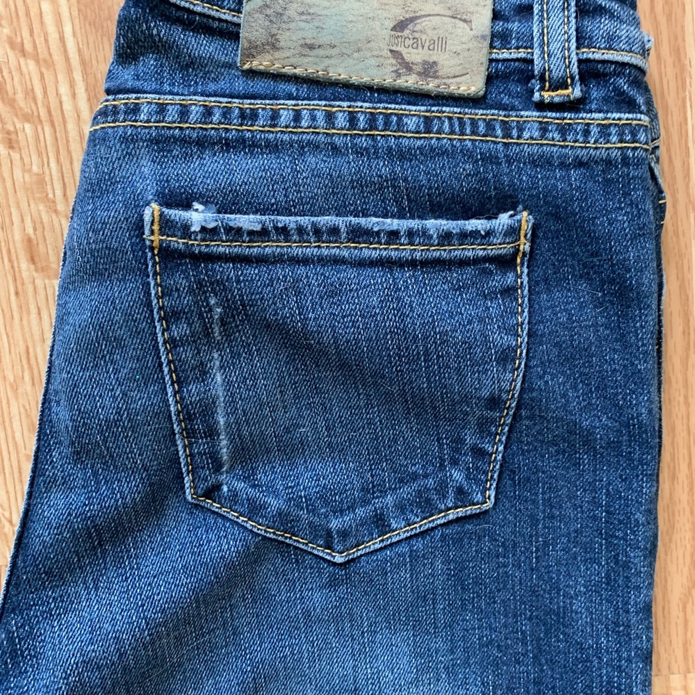 Woman’s distressed “Just Cavalli” Designer Blue Jeans